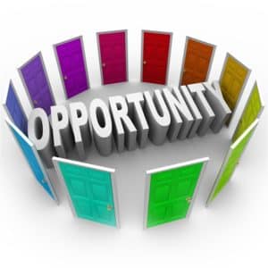 The word Opportunity in 3D letters surrounded by doors of different colors to illustrate a chance for a new career, path, fortune, or big break in your job or life