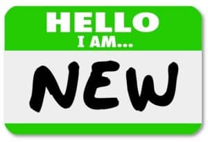 A green nametag sticker with the words Hello I Am New for a rookie, trainee, new staff hire, newbie, beginner or apprentice