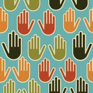 Multi-Ethnic human hands seamless pattern background. Vector file layered for easy manipulation and custom coloring.