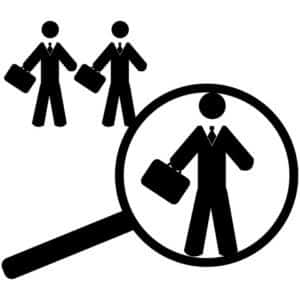 Concept illustration showing a magnifying glass finding a worker suitable for a job position